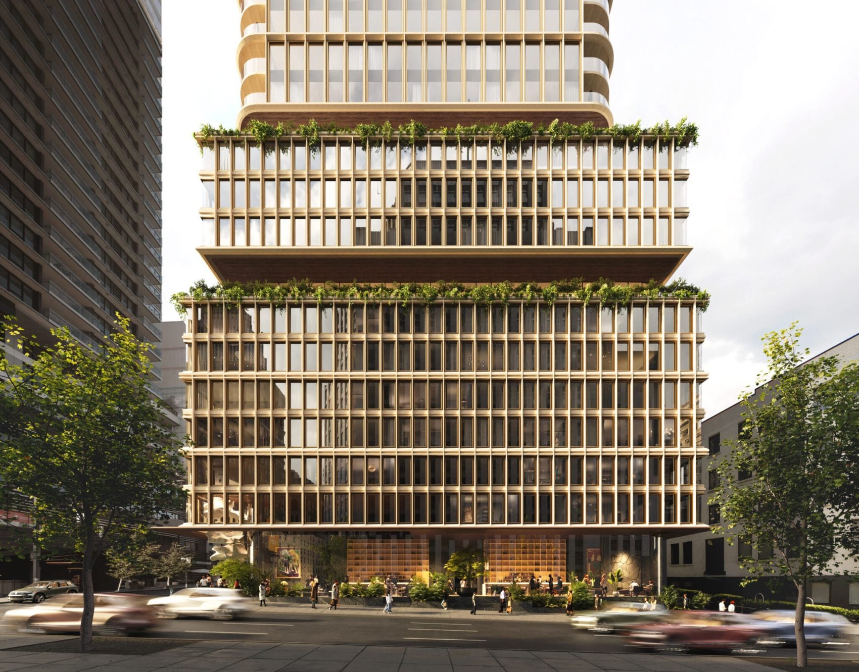 Modern high-rise hotel exterior with wooden slatted facade, green terraced balconies, and street-level entrance.