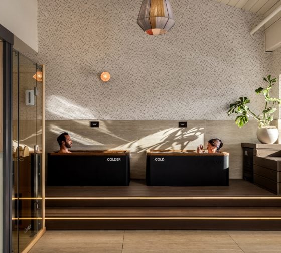 Spa relaxation room with loungers and a pendant lamp