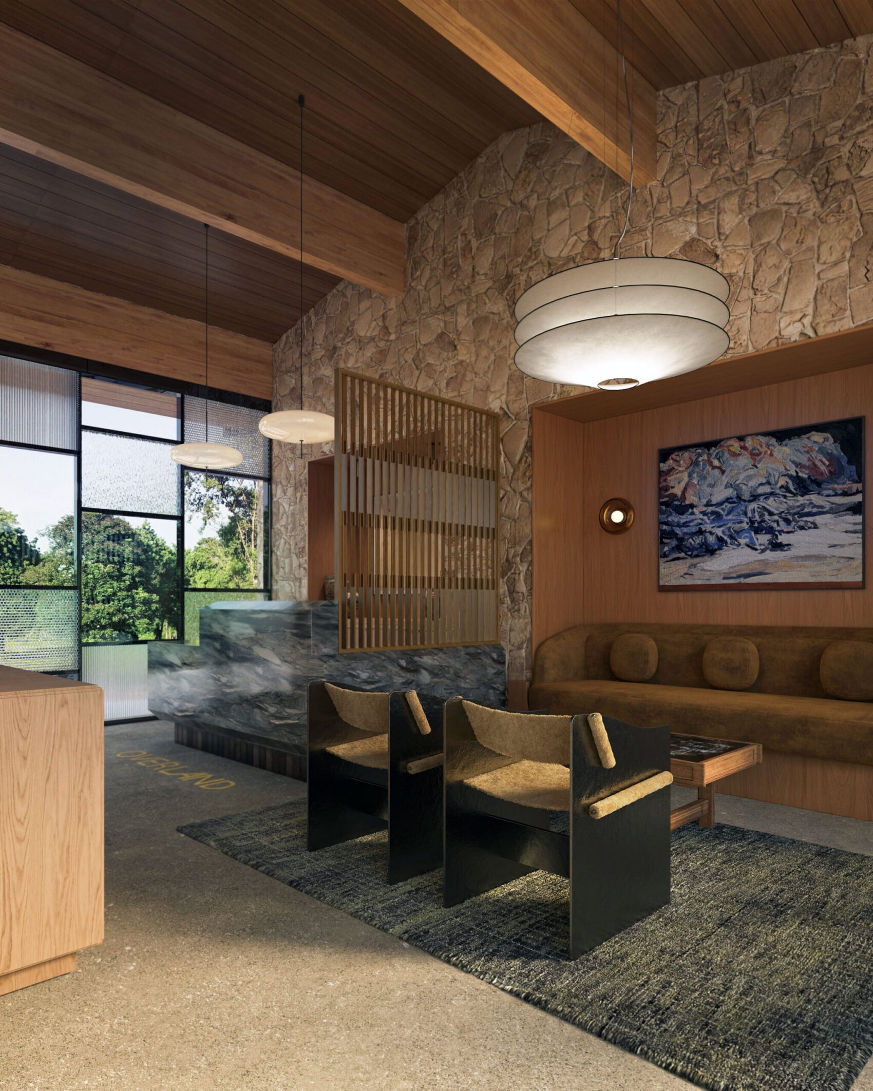 Hotel lounge with a stone wall, timber ceiling and low seating