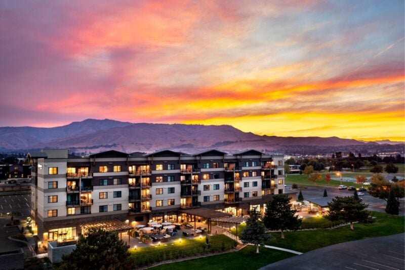 Hotel exterior under a colourful sunset sky