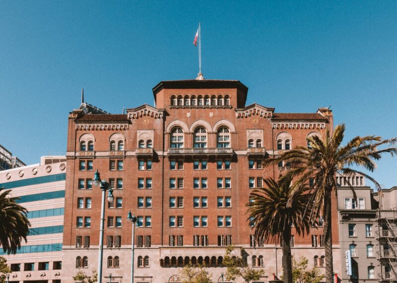 Historic brick hotel facade against a blue sky