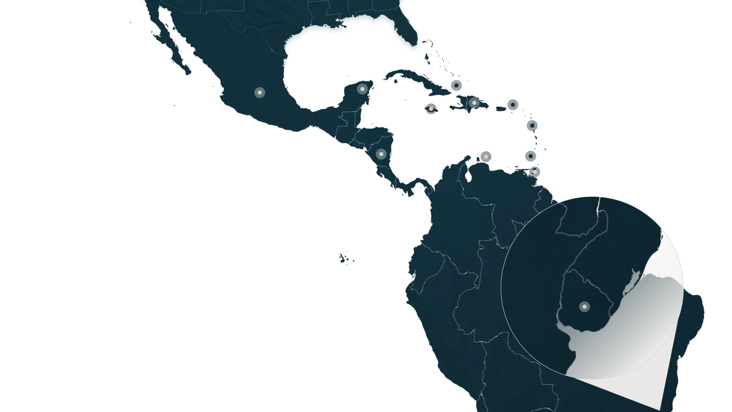 Map of the Caribbean and Latin America marked with pinpoints for property locations