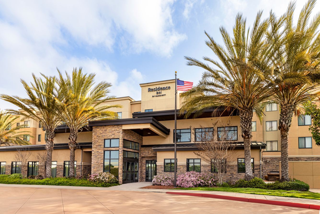 Residence Inn by Marriott hotel entrance framed by palm trees